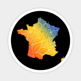 Colorful mandala art map of France with text in blue, yellow, and red Magnet